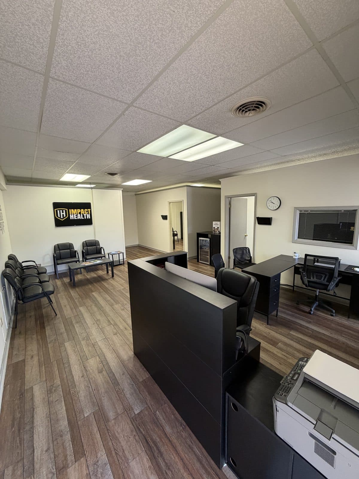 Reception and front office at Impact Health Tupelo with check-in desk and waiting area